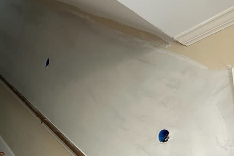 Drywall taped, floated and sanded smooth into the ceiling line on a Memphis stairwell by Drywall & Remodeling ETC.